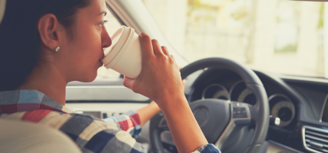 woman-driving-with-coffee